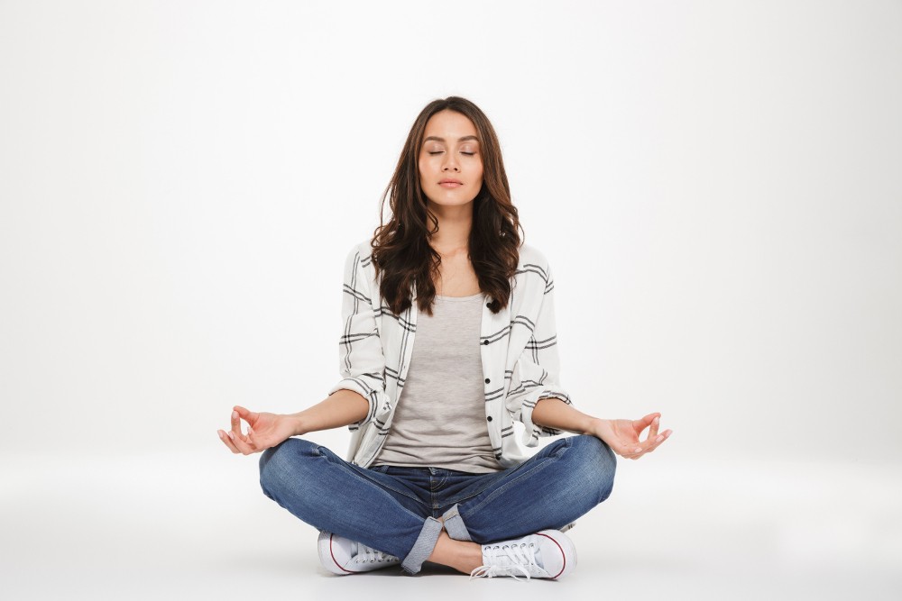 image of young woman meditating